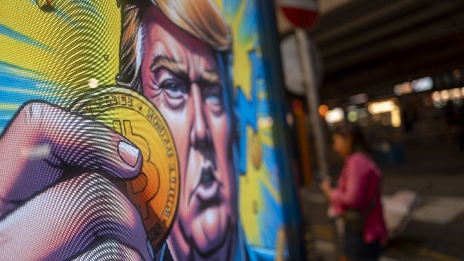 Bitcoin reached a record high of $106,533, fueled by President-elect Donald Trump's comments about creating a US Bitcoin reserve. Photo: A cartoon image of US President-elect Donald Trump holding a Bitcoin token to mark the cryptocurrency reaching over $100,000 displayed at a Coinhero store in Hong Kong.